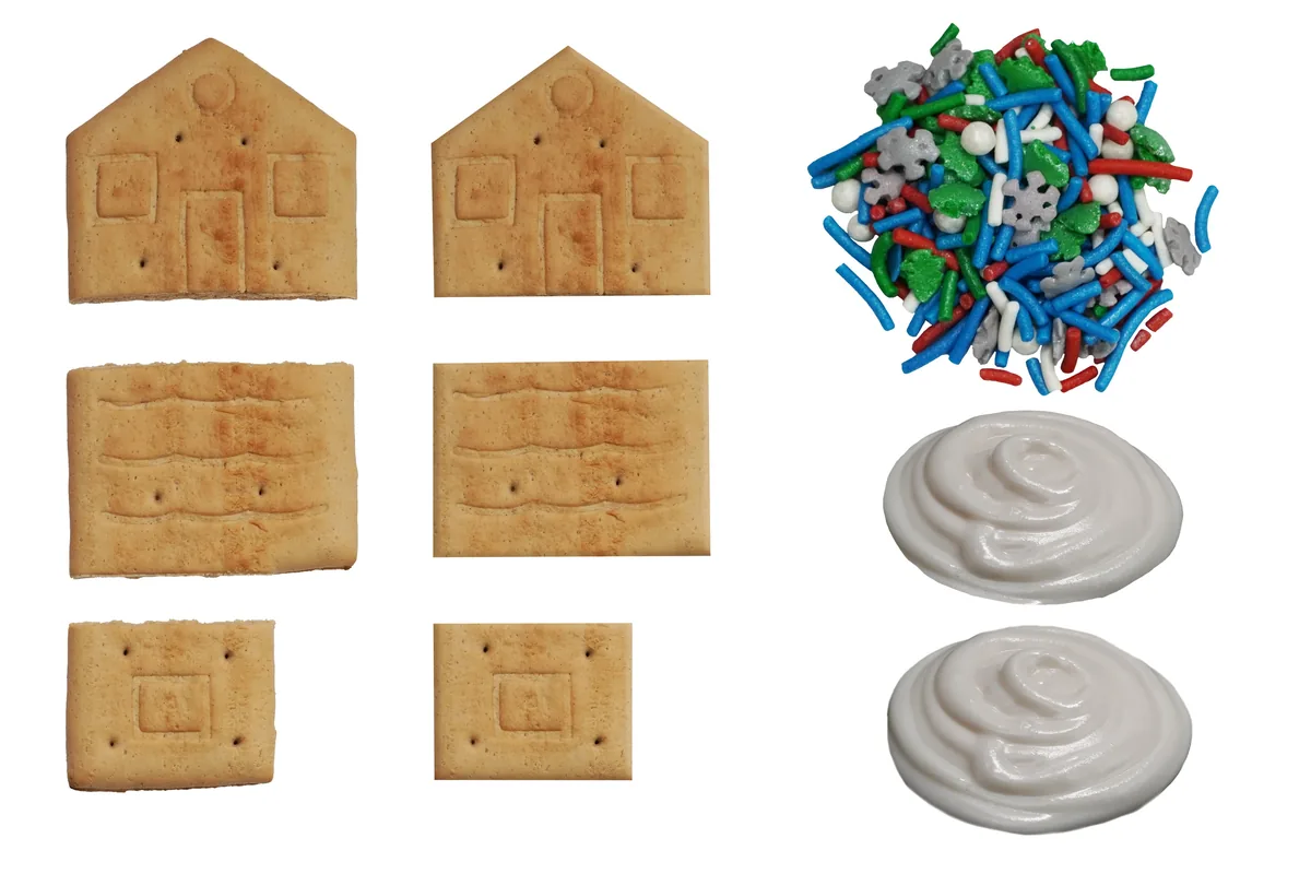 Fotografía de producto recortada sobre fondo blanco: kit de casita de jengibre con galletas, chispas y betún